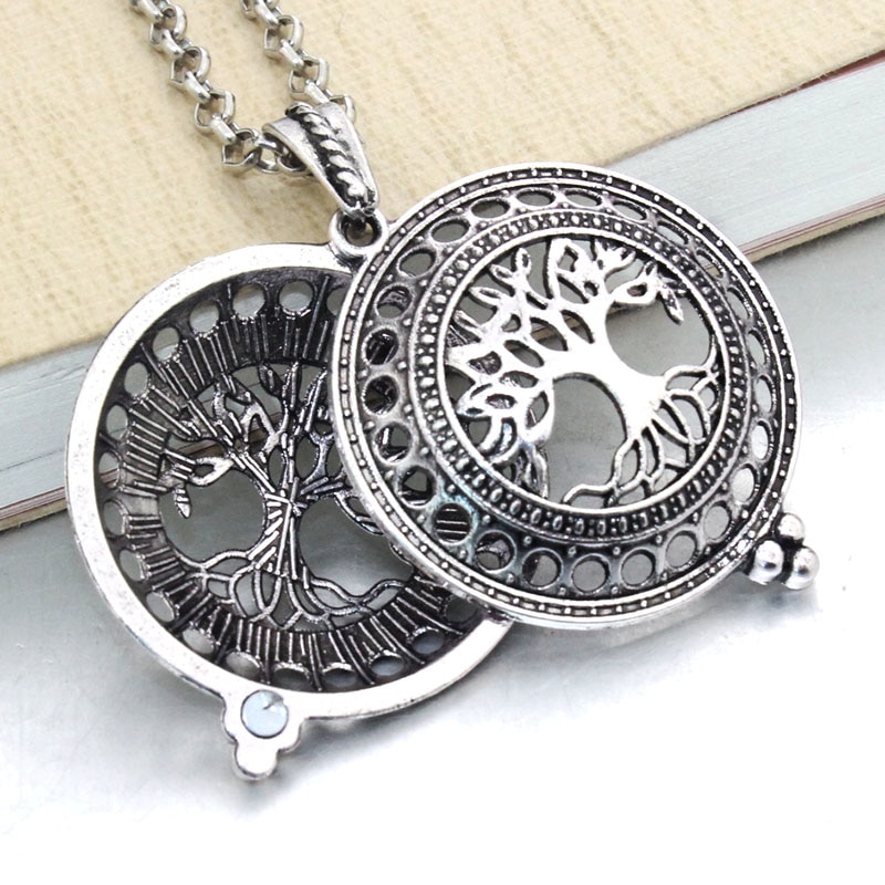 Aroma Essential Oil Diffuser Pendant Necklace with a tree design, echoing the new fashion trends, open to reveal circular compartments.