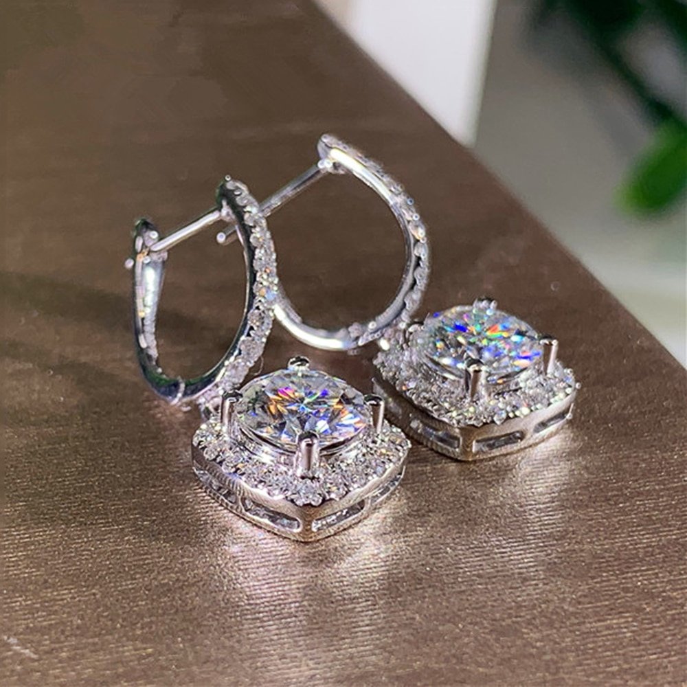 A pair of Women's Crystal Drop Earrings displayed on a table.