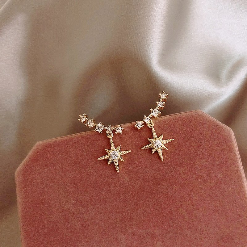 Women's Star Earrings on a pink background, perfect for women.