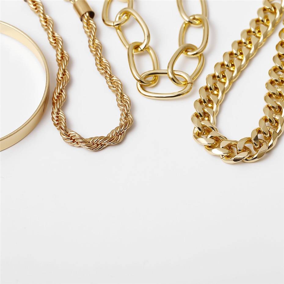 Various styles of Curb Cuban Chain Bracelets Set for Women, 4 Pcs, representing new fashion trends, are displayed on a white background.