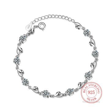 A Women's 925 Sterling Silver Zircon Bracelet with blue gemstones and clear crystals, capturing the essence of new fashion style, showcased on a white background.