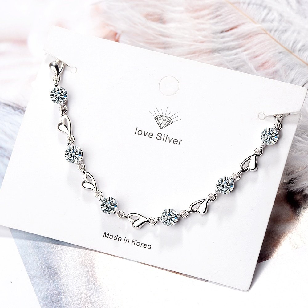 Women's 925 Sterling Silver Zircon Bracelet - Hearts Design featuring floral design elements on a white background, labeled "i love silver" and "made in Korea," is a fashionable accessory that complements women's fashion trends.