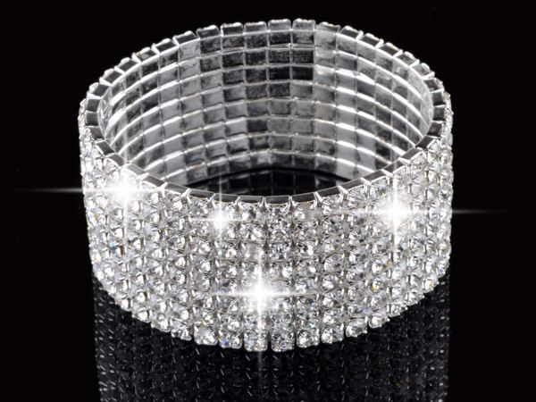 A Full Rhinestone Elastic Bracelet for Women, reflecting the latest fashion trends, on a reflective surface.