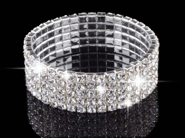 Full Rhinestone Elastic Bracelet for Women on a reflective surface as a new fashion accessory.