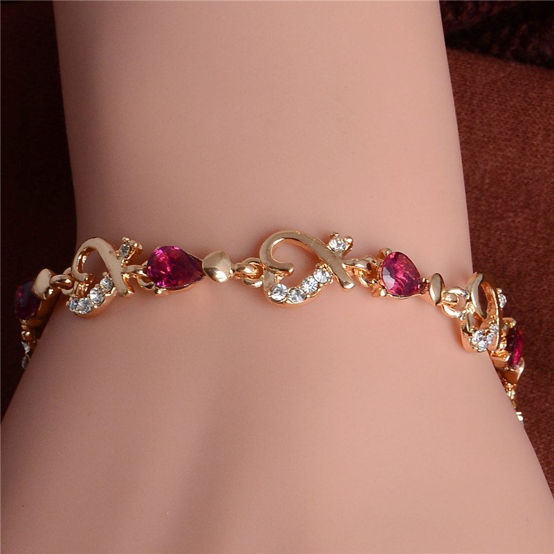 Women's Fashion Colorful Bracelets with pink gemstones, a new fashion accessory worn on a wrist.